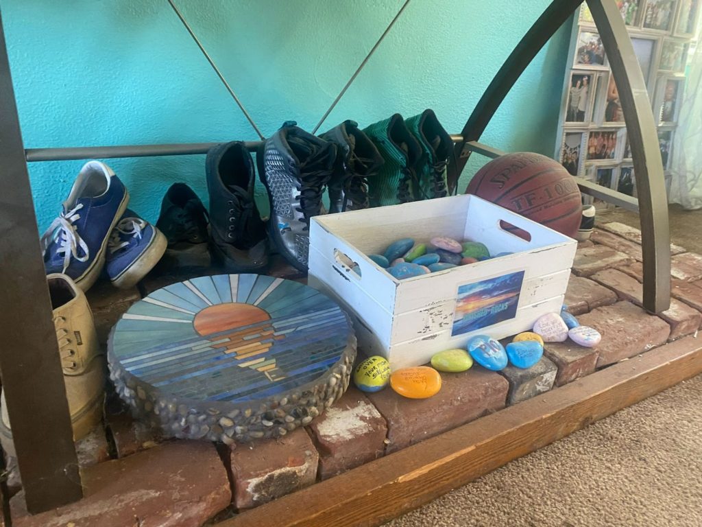 Emilio’s shoes, basketball and other belongings are displayed in Cammie Velci’s living room.